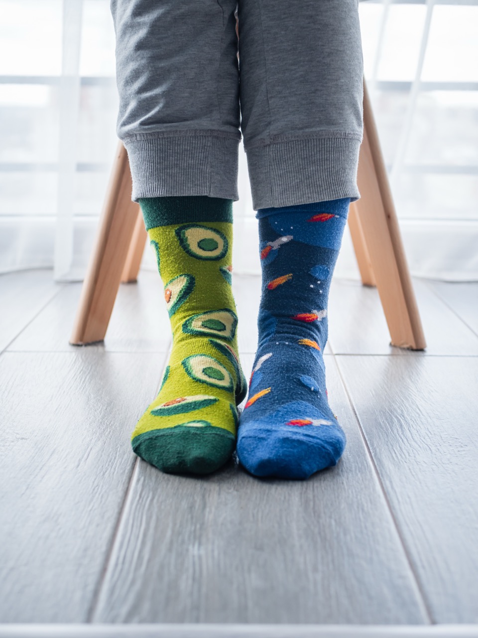 Mismatched artistic socks on feet